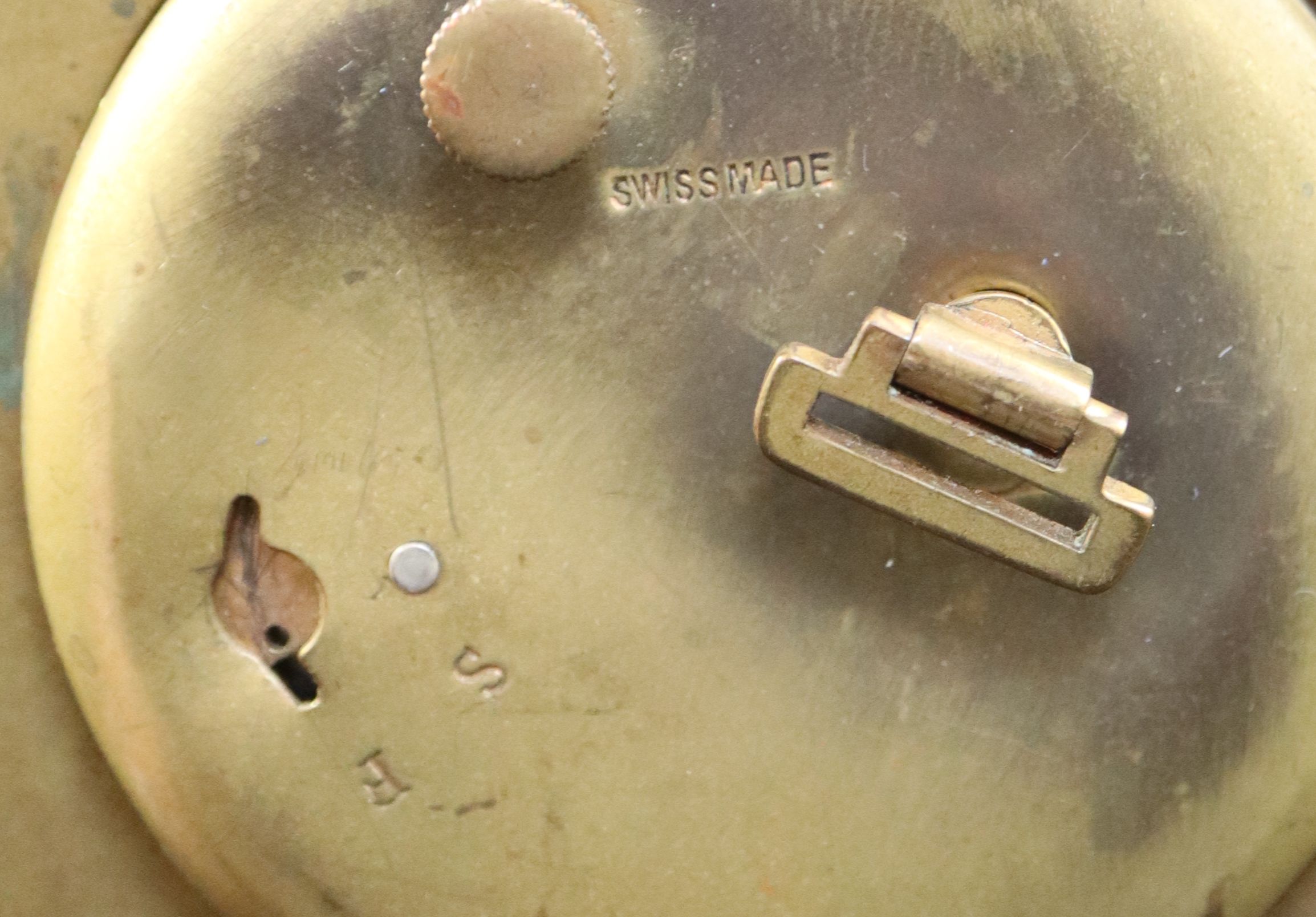 A mid 20th century Swiss enamelled brass eight day travelling timepiece, 10.5cm